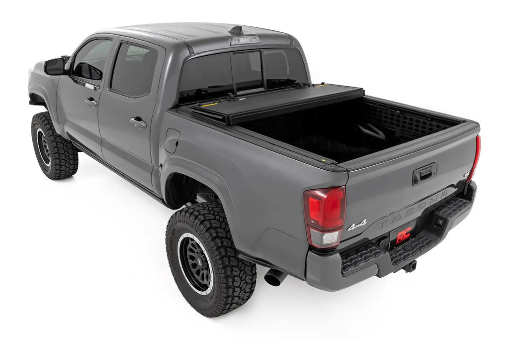 Hard Tri-Fold Flip Up Bed Cover | 5' Bed | Toyota Tacoma 2WD/4WD (2016-2023) by Rough Country
