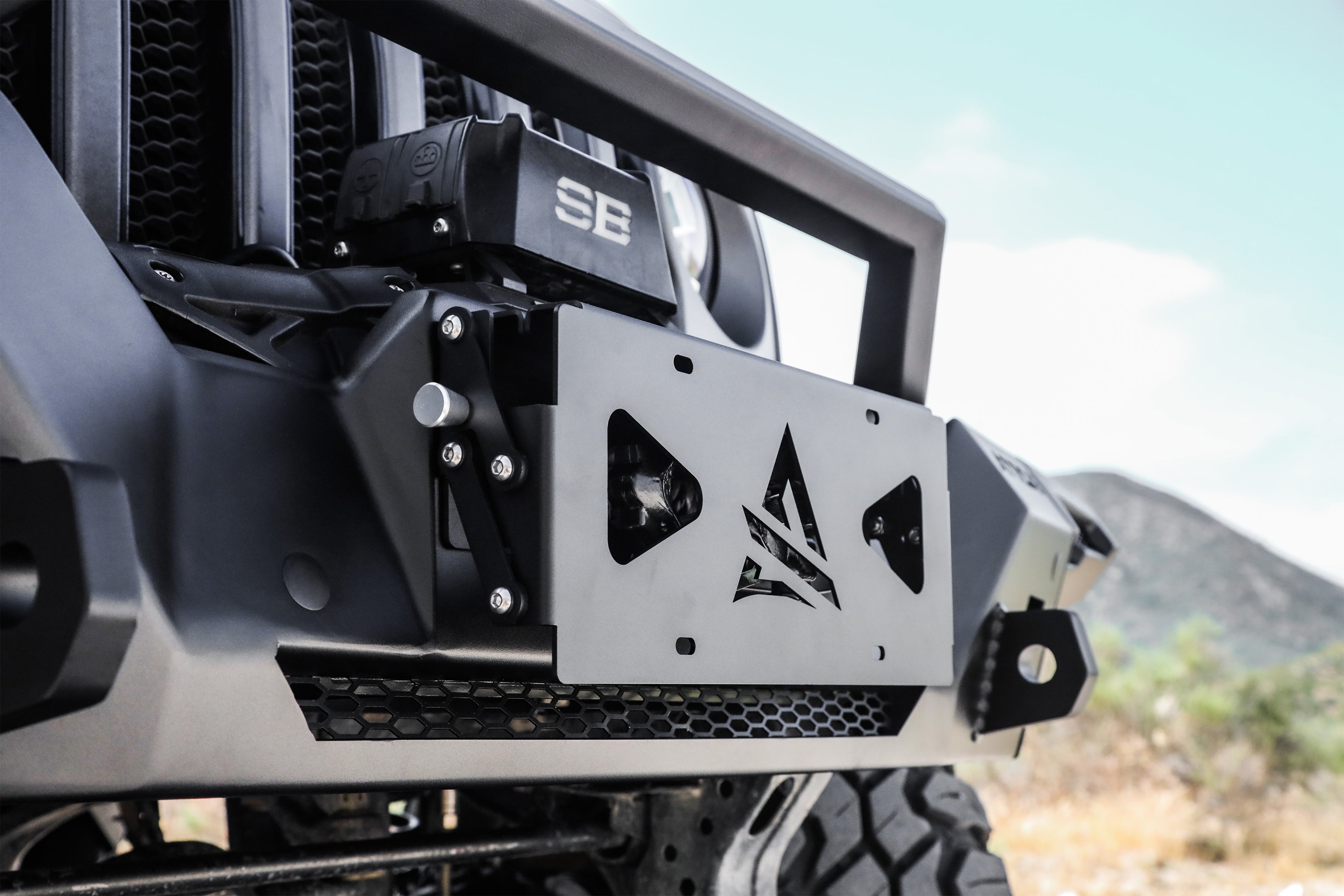Universal Terra Series Flip-Up Roller Fairlead License Plate Bracket by Attica 4x4