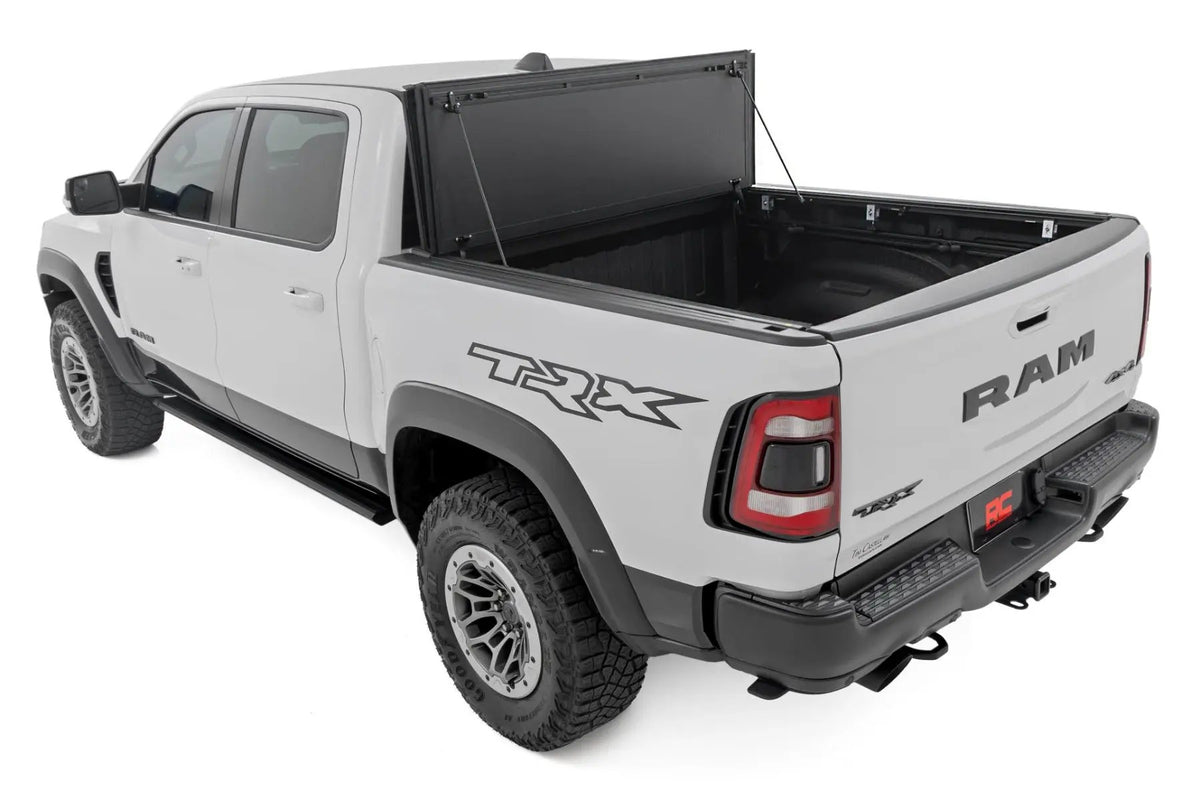 Hard Tri-Fold Flip Up Fold Bed Cover | 5'7" Bed | Ram 1500 (19-26)/1500 TRX (21-24) by Rough Country