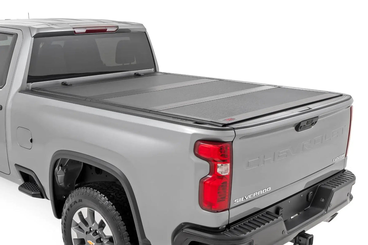 Hard Tri-Fold Flip Up Bed Cover | 6'9" Bed | Chevy/GMC Silverado/Sierra 2500HD/3500HD (20-26) by Rough Country