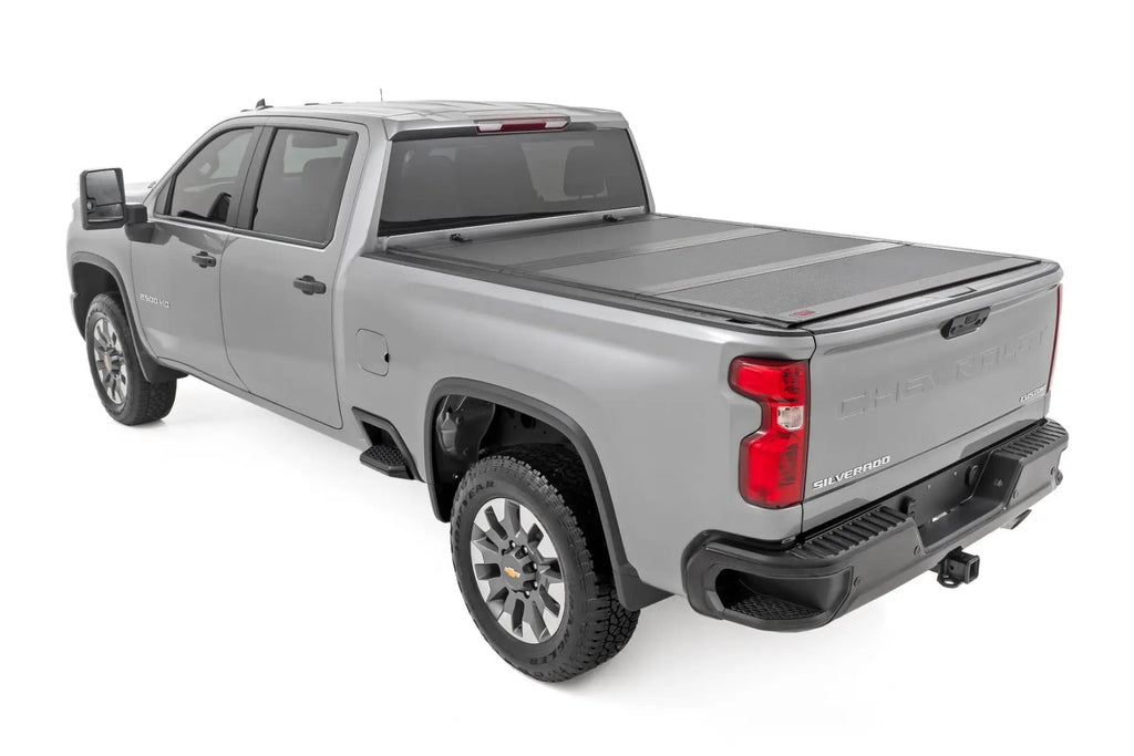 Hard Tri-Fold Flip Up Bed Cover | 6'9" Bed | Chevy/GMC Silverado/Sierra 2500HD/3500HD (20-26) by Rough Country