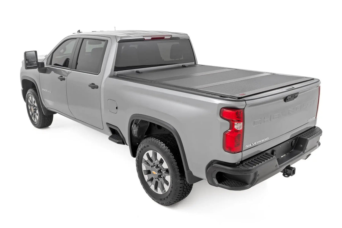 Hard Tri-Fold Flip Up Bed Cover | 6'9" Bed | Chevy/GMC Silverado/Sierra 2500HD/3500HD (20-26) by Rough Country