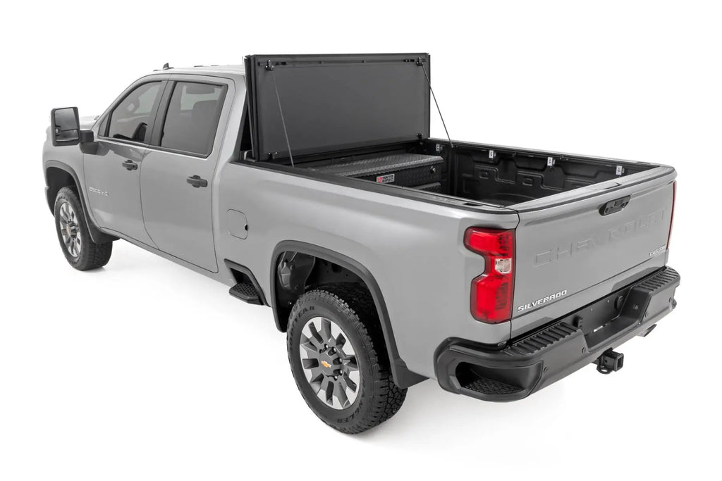Hard Tri-Fold Flip Up Bed Cover | 6'9" Bed | Chevy/GMC Silverado/Sierra 2500HD/3500HD (20-26) by Rough Country